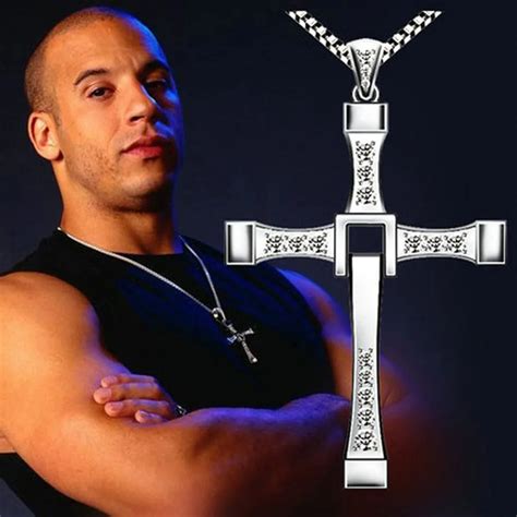 Dominic toretto necklace - Dom Toretto's silver cross pendant necklace made its very first appearance in 2001's The Fast and the Furious, and has become a powerful symbol of family and connection in the Fast franchise. It ...